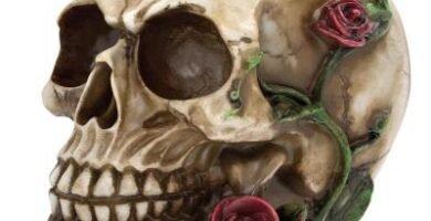 Vintage resin skull figurine with red blossoms home decor ornament