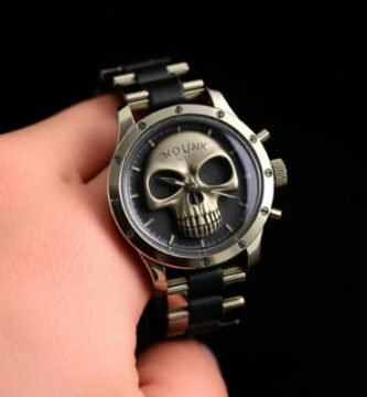 Luxury gothic skull watch with metallic bronze face and black strap