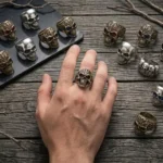 Skull rings collection featuring gothic silver and gold designs with gemstone accents
